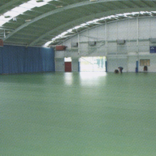 Sports hall with green sports floor protection laid