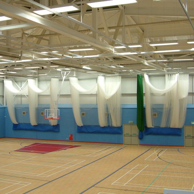 Three double cricket bay nets and one green division net stored away